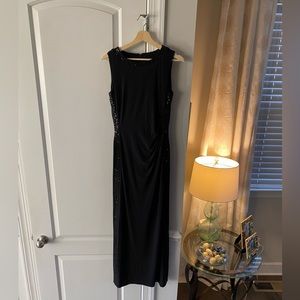Black long cocktail dress with sparkle embellishments on the side. Worn once.
